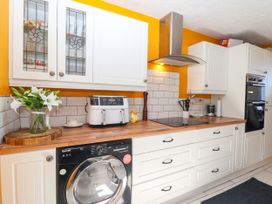 A kitchen with appliances and a countertop at Angels Place in Yelverton