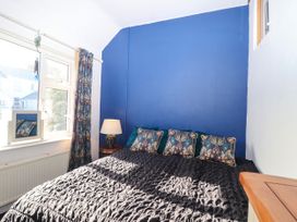 A bedroom with a bed and pillows at Angels Place in Yelverton
