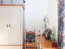 A corner with a wardrobe and stool at Angels Place in Yelverton