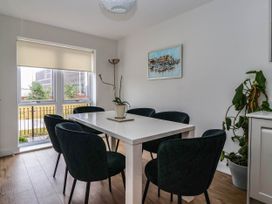 A dining room with a table and chairs at Blanket Row in Hull