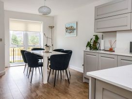 A dining room with a table and chairs at Blanket Row in Hull