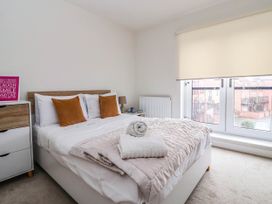 A bedroom with a bed and window at Blanket Row in Hull