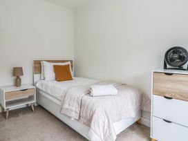 A bedroom with a single bed and nightstand at Blanket Row in Hull