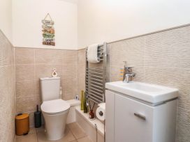 A bathroom with a toilet and sink at Blanket Row in Hull