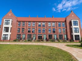 A building with multiple windows and doors at Blanket Row in Hull
