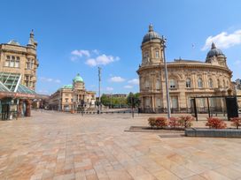 An outdoor view of historic buildings and a plaza at Blanket Row in Hull