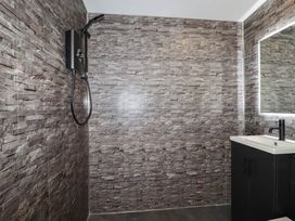 A bathroom with a shower and sink at The Hyde, Tazamble cottage Launceston