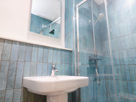 A bathroom with a sink and shower at Top Deck in St. Ives