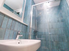 A bathroom with a sink and shower at Top Deck in St. Ives