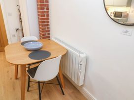 A dining room with a table and chairs at The Cabin in St Ives