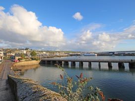 A harbor with a bridge and boats in the water at The Cabin in St Ives