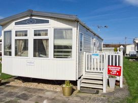 A static caravan with reserved parking sign at Beachcomber Cabin Dog Friendly Anderby Creek Lincolnshire