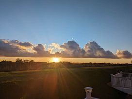 A sunset with clouds and a horizon at Beachcomber Cabin Dog Friendly Anderby Creek Lincolnshire