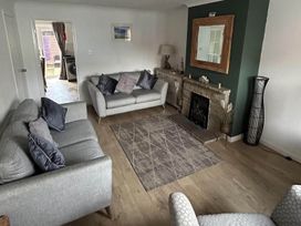 A living room with sofas and a fireplace
