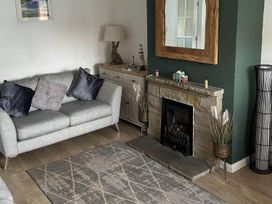 A living room with a sofa and fireplace at the property in location