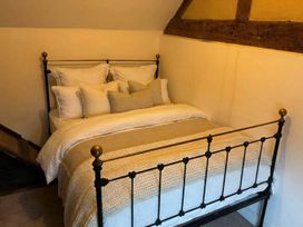A bedroom with a bed and pillows at The Old Barn in Manchester