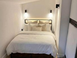 A bedroom with a bed and pillows at The Old Barn in Manchester