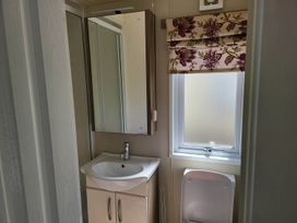 A bathroom with a sink and toilet at 