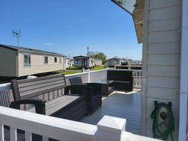 An outdoor area with seating and a view of mobile homes at '' 