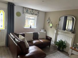 A living room with a sofa and a fireplace at 