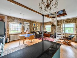 A living room with a sofa and coffee table at Beautiful Pad Near World Heritage Jurassic Coast Pymore near Bridport