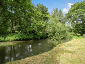A river surrounded by trees and grass at Beautiful Pad Near World Heritage Jurassic Coast Pymore near Bridport