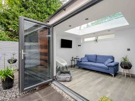 A snug with a sofa and armchair at Detached House in Quiet Village Pets Allowed Ashbocking near Otley, Suffolk