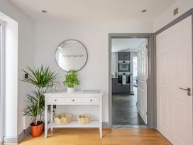 A hallway with a side table and plants at Detached House in Quiet Village Pets Allowed Ashbocking near Otley, Suffolk
