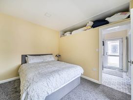 A bedroom with a bed and door at Cottage Sleeps 6 with Parking and Garden in Bridlington