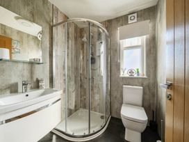 A bathroom with a shower and toilet at Seaside Chalet Retreat in Bridlington