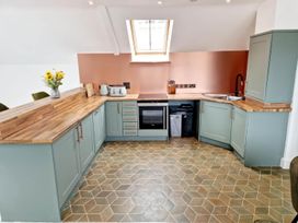 A kitchen with countertops and appliances at Apartment Sleeps 4 with Balcony and Parking in Kingsbridge