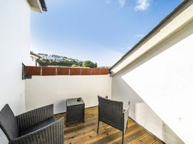 A balcony with two chairs and a table at Apartment Sleeps 4 with Balcony and Parking in Kingsbridge