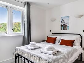 A bedroom with a bed and window at Apartment Sleeps 4 with Balcony and Parking in Kingsbridge