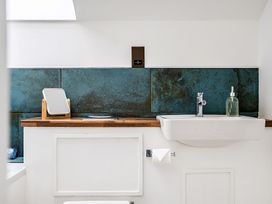 A bathroom with a sink and mirror at Apartment Sleeps 4 with Balcony and Parking in Kingsbridge