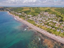 A coastal view with houses and beach at Torpoint Apartment Sleeps4 Seaside Parking in Downderry