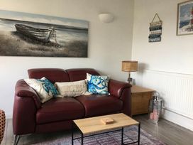 A living room with a sofa and coffee table at Torpoint Apartment Sleeps4 Seaside Parking in Downderry
