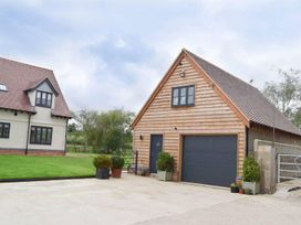A house and garage with grass area at 1bed Pet Friendly nr Bicester village near Bicester