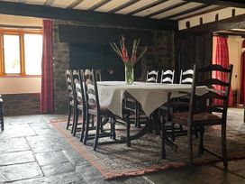 A dining room with a table and chairs at the property