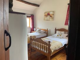 A bedroom with two single beds and a window at the property in an undisclosed location