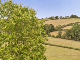 A view of a field with sheep and trees at 16th Century Devon Farmhouse Stunning Views Winkleigh