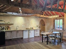 A kitchen with a table and chairs at Pet Friendly 3Bed Barn Sleeps 7 Parking Garden Westhall near Halesworth