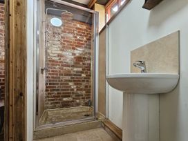 A bathroom with a shower and a sink at Pet Friendly 3Bed Barn Sleeps 7 Parking Garden Westhall near Halesworth