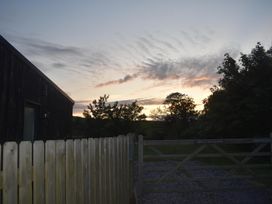 An outdoor view with a fence and a gate at Pet friendly Cabin Sleeps 6 with Parking and Garden in Penygroes