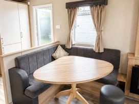 A dining area with a table and couch at 