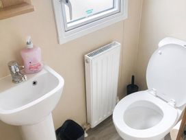 A bathroom with a sink and toilet at the property