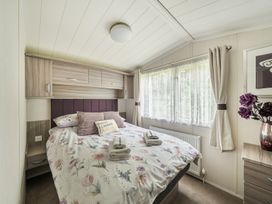 A bedroom with a bed and window at 
