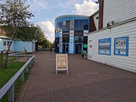 An outdoor area with a sign and a building at Quayside in an unspecified location