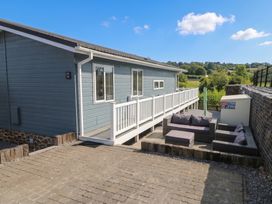 An outdoor seating area with furniture at Pleasant Valley Holiday Lodge 70 Stepaside