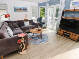 A living room with a sofa and coffee table at Pleasant Valley Holiday Lodge 70 Stepaside