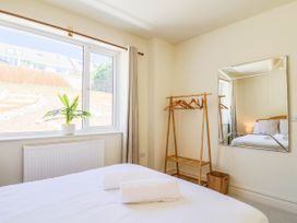 A bedroom with a bed and window at 30 Southdown Avenue Weymouth